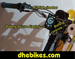 Custom made to order Womens electric downhill mountain bike by Pinnacle Innovations cockpit view showing the GripShift shifters, high rise bar and the Bafang 750 Watt mid mount electric motor throttle.
