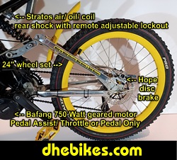 Custom made to order Womens electric downhill mountain bike by Pinnacle Innovations side view showing the Stratos rear air/ oil/coil shock with remote lockout and the 24 inch downhill mountain bike wheelset.
