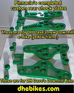 Pinnacle Innovations picture showing completed custom made and anodized suspension plates for two Norco custom downhill bike's long travel rear suspension linkage plates made from 6061 aircraft aluminum.
