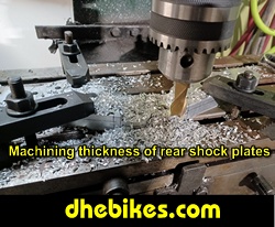 Photo showing the planing the thickness of the 3/4 inch thick 6061 aluminum rear suspension plates that will almost double the amount of travel.