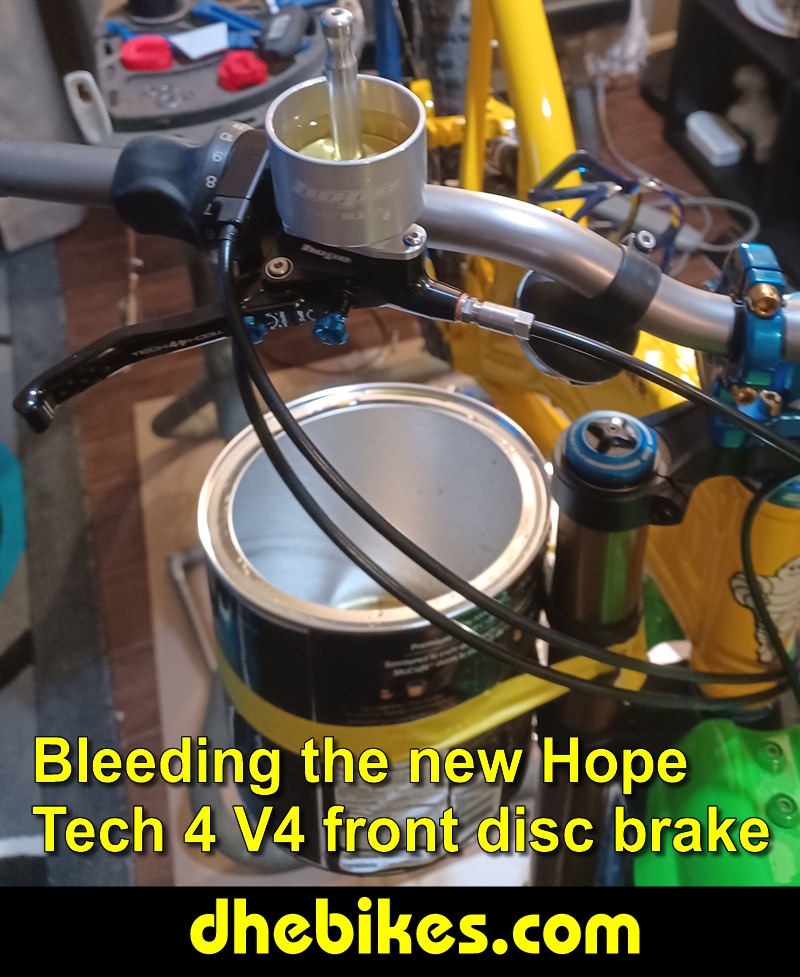 Pinnacle Innovations picture showing bleeding the new Hope Tech 4 Version 4 Downhill Mountain Bike Disc Brakes for a Norco custom electric downhill bike.